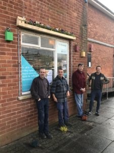 Residents of Sutton Way show the outdoor furniture they made & installed at Urban Workbench Learning Programme in the Ellesmere Port satellite workshop