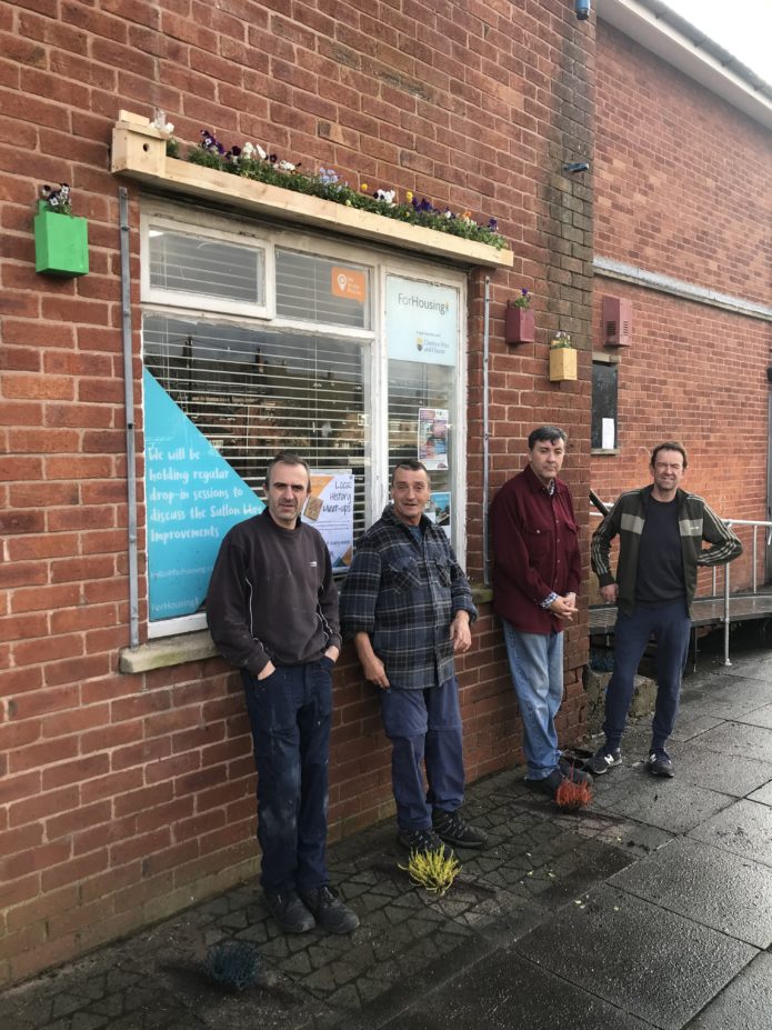 Residents of Sutton Way show the outdoor furniture they made & installed at Urban Workbench Learning Programme in the Ellesmere Port satellite workshop